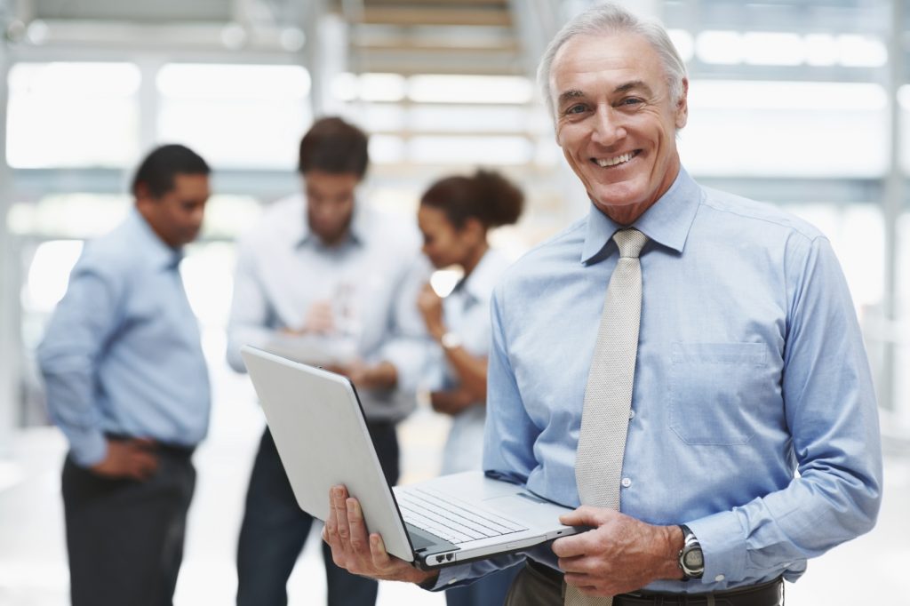 Senior-businessman-with-laptop